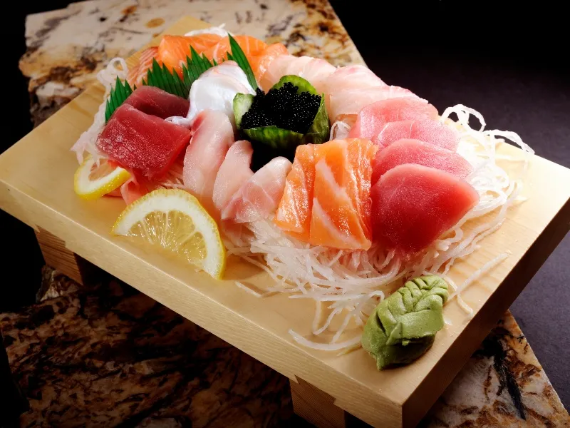 Luxury mixed sashimi platter served on wooden board at Mici Asian Bistro，a Asian Fusion Restaurant in Trumbull