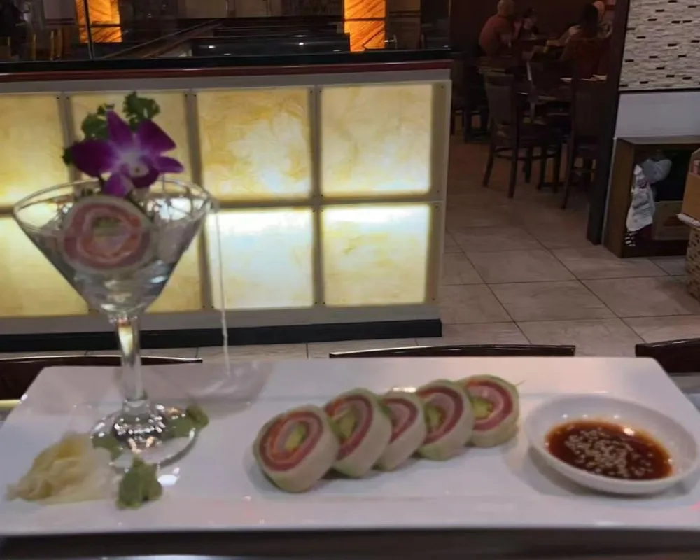 Special maki roll served in martini glass with dipping sauce on side at Mici Asian Bistro，a Asian Fusion Restaurant in Trumbull